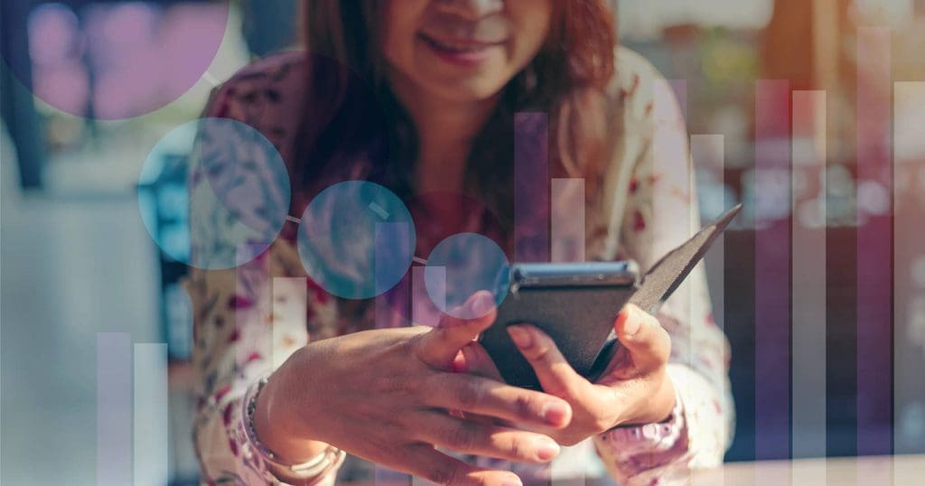 grocery retail innovation, woman holding cellphone with faded graphs overlaid