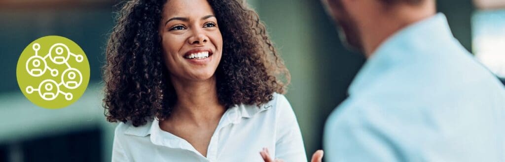 woman attending a networking session to get a job in tech